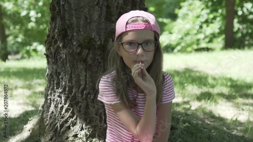 Beautiful little girl eating candy HD