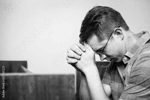 Man Praying in the Church, Black and White Color.