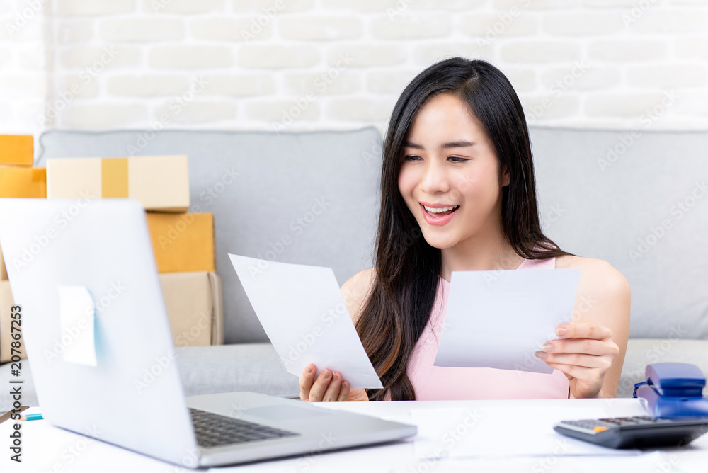 Young woman freelance online seller working at home Young woman freelance online seller working at home