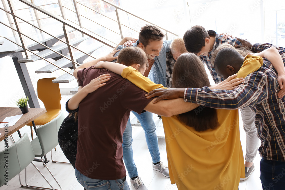 People standing together in circle indoors. Unity concept People standing together in circle indoors. Unity concept