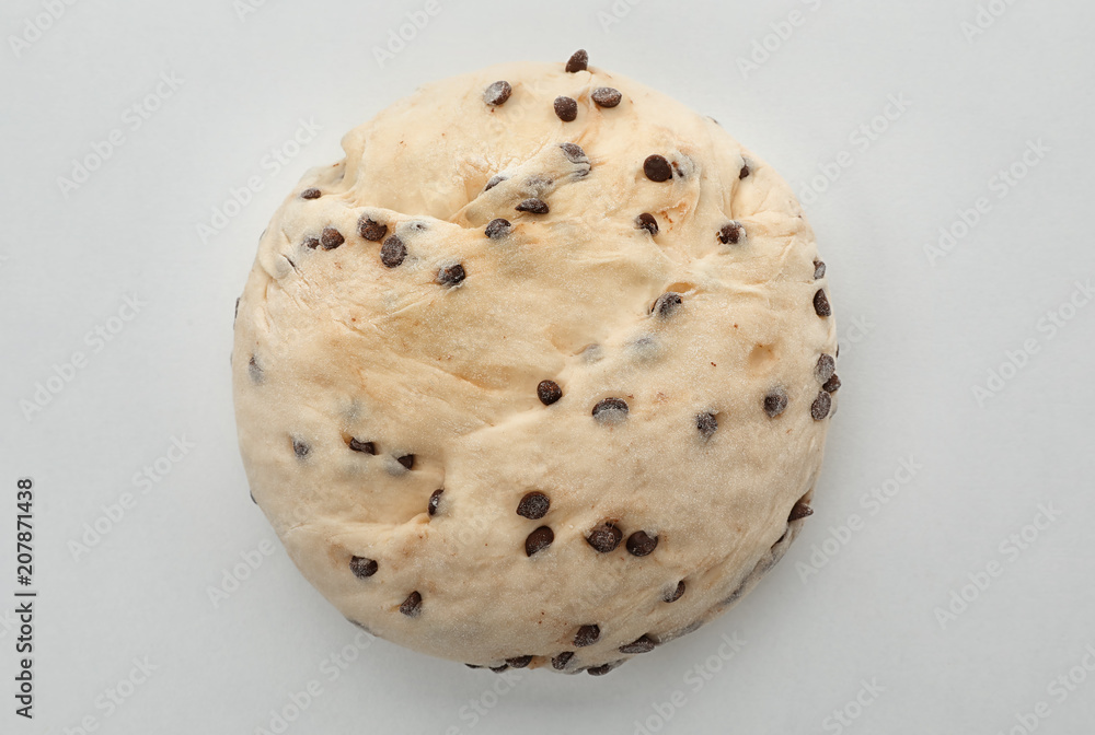 Raw wheat dough with chocolate chips on white background, top view Raw wheat dough with chocolate chips on white background, top view