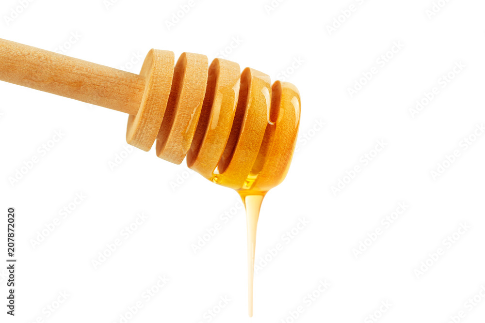 honey with wooden drizzler isolated on white background honey with wooden drizzler isolated on white background