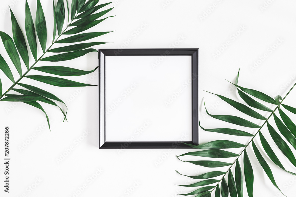 Tropical palm leaves, photo frame, on white background. Summer concept. Flat lay, top view, copy space - obrazy, fototapety, plakaty 