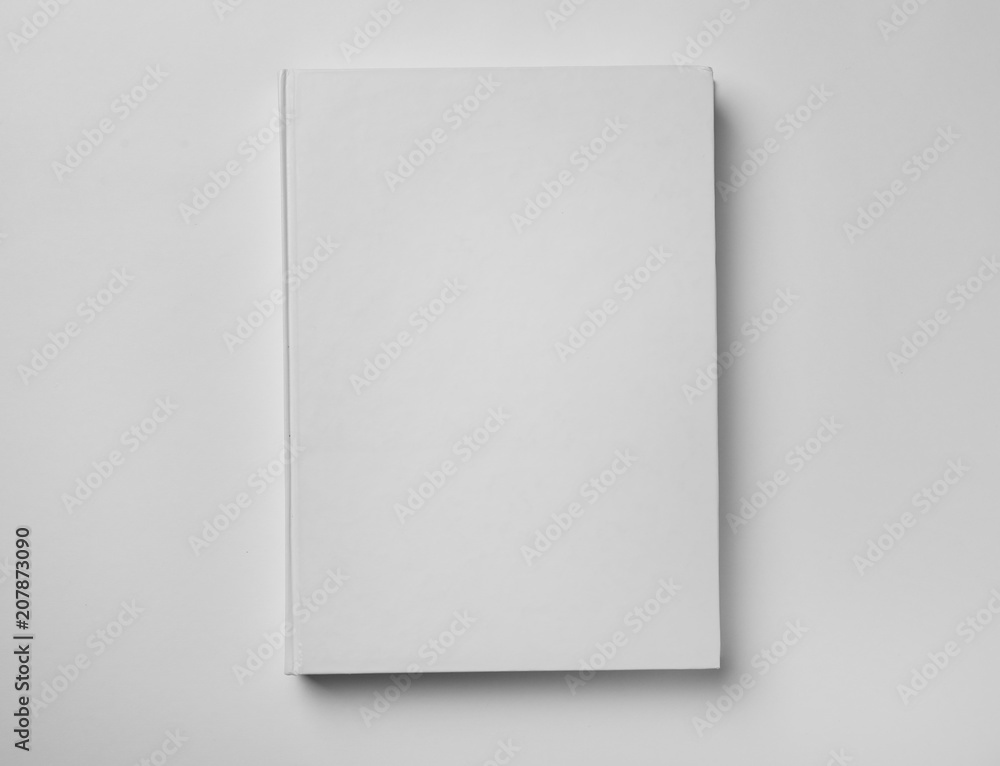 Mockup of hardcover book on white background, top view Mockup of hardcover book on white background, top view