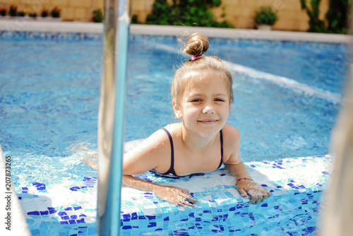 child in pool © Elena Stepanova