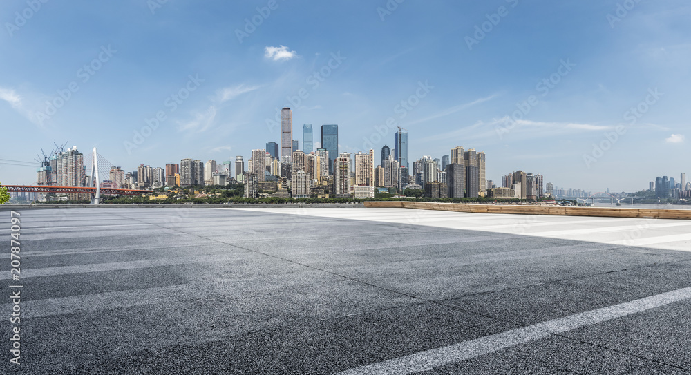 Panoramic skyline and buildings with empty road Panoramic skyline and buildings with empty road