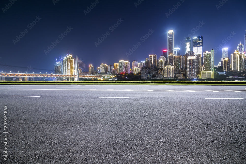 Panoramic skyline and buildings with empty road，chongqing city at night