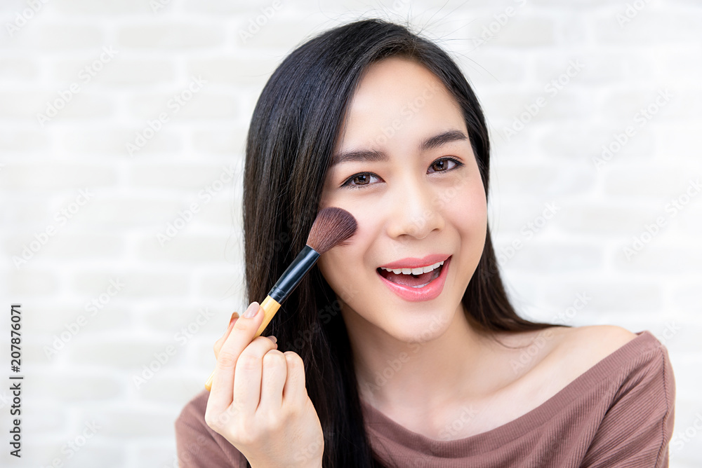 Beautiful Asian woman beauty blogger doing make up tutorial Beautiful Asian woman beauty blogger doing make up tutorial