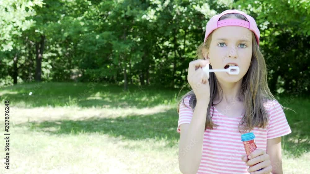 Beautiful little girl playing with bubbles 4K Beautiful little girl playing with bubbles 4K