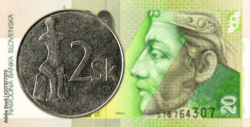 2 slovak koruna coin against 20 slovak koruna banknote obverse photo