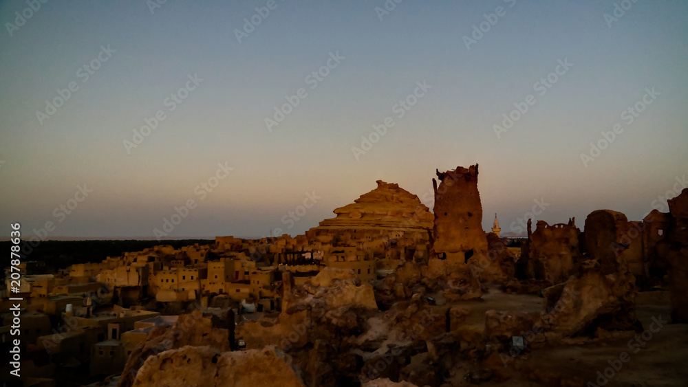 Panorama of old city Shali and mountain Dakrour, Siwa oasis at sunrise , Egypt