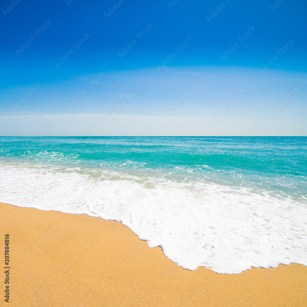 Beautiful Tropical beach with Soft wave of blue ocean, sand and transparent sky. Summer travel holiday background concept. Sea panorama. Beautiful Tropical beach with Soft wave of blue ocean, sand and transparent sky. Summer travel holiday background concept. Sea panorama.