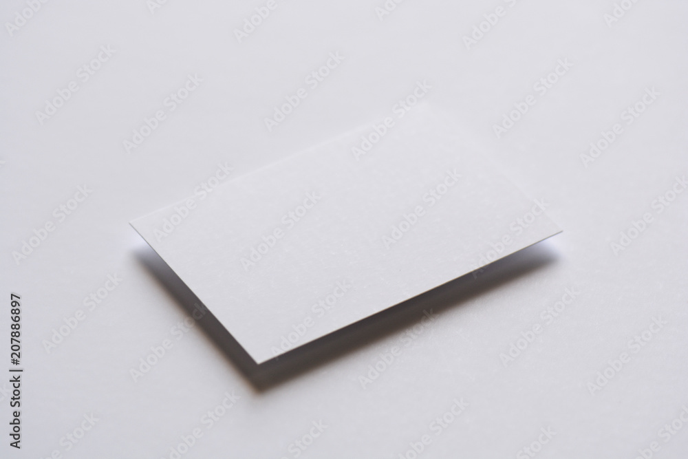 Photo of blank white business cards on white. Mock-up for branding identity. For graphic designers presentations and portfolios Photo of blank white business cards on white. Mock-up for branding identity. For graphic designers presentations and portfolios