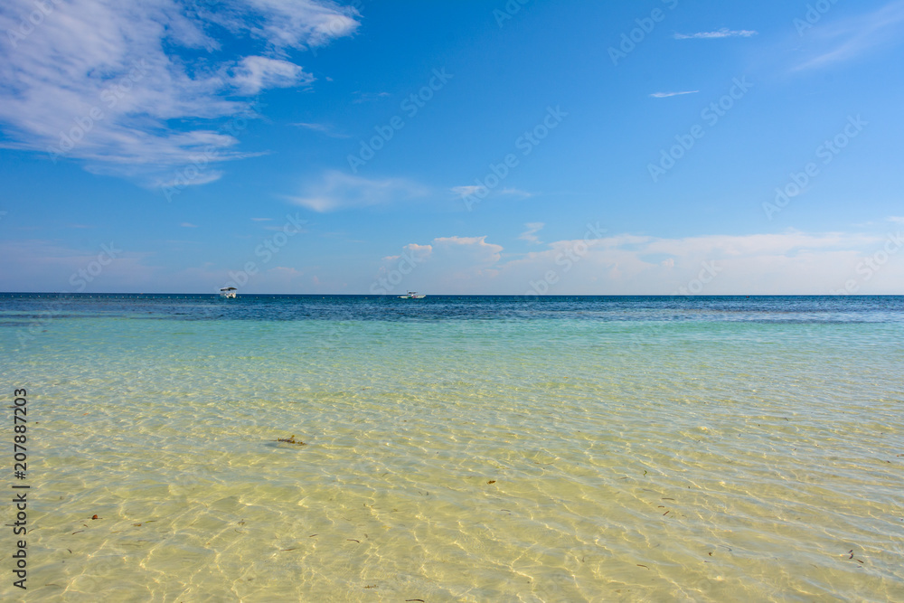 Sea view from tropical beach and sunny sky. Exotic ocean beach. Sea view from tropical beach and sunny sky. Exotic ocean beach.
