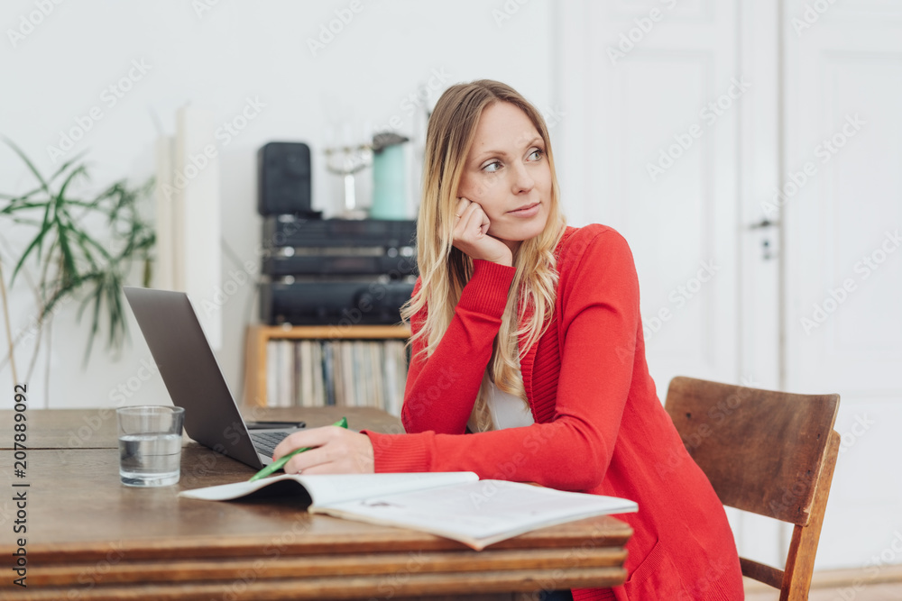 Young businesswoman turning and watching