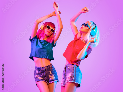 Two DJ Girl Hipster with Fashion Hairstyle Dance.