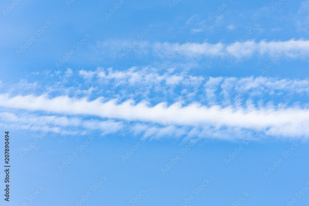 Kelvin Helmholtz instability clouds wavy on blue sky. Kelvin Helmholtz instability clouds wavy on blue sky.