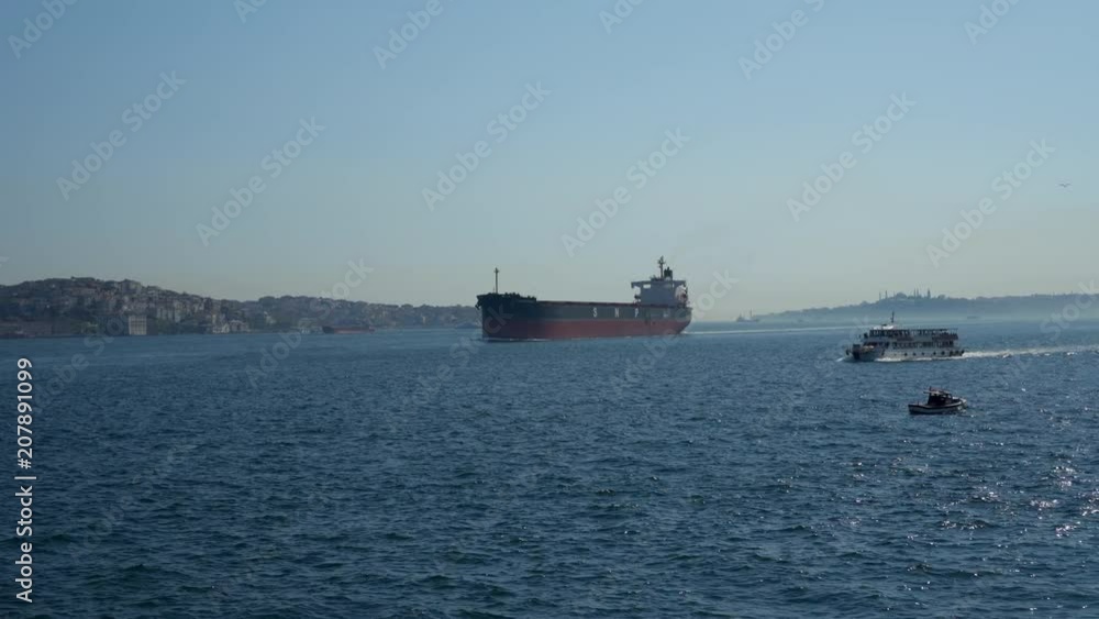 ISTANBUL, TURKEY - APRIL, 24, 2018: Boats and ferries sailing through the Bosporus ISTANBUL, TURKEY - APRIL, 24, 2018: Boats and ferries sailing through the Bosporus