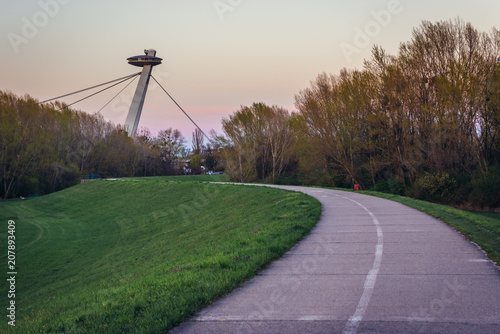 Photography So called UFO Bridge seen from cycle path on a embankment of Danube River in Bra