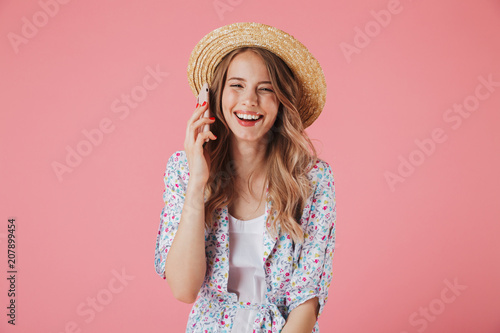 Portrait of a laughing young woman in summer dress