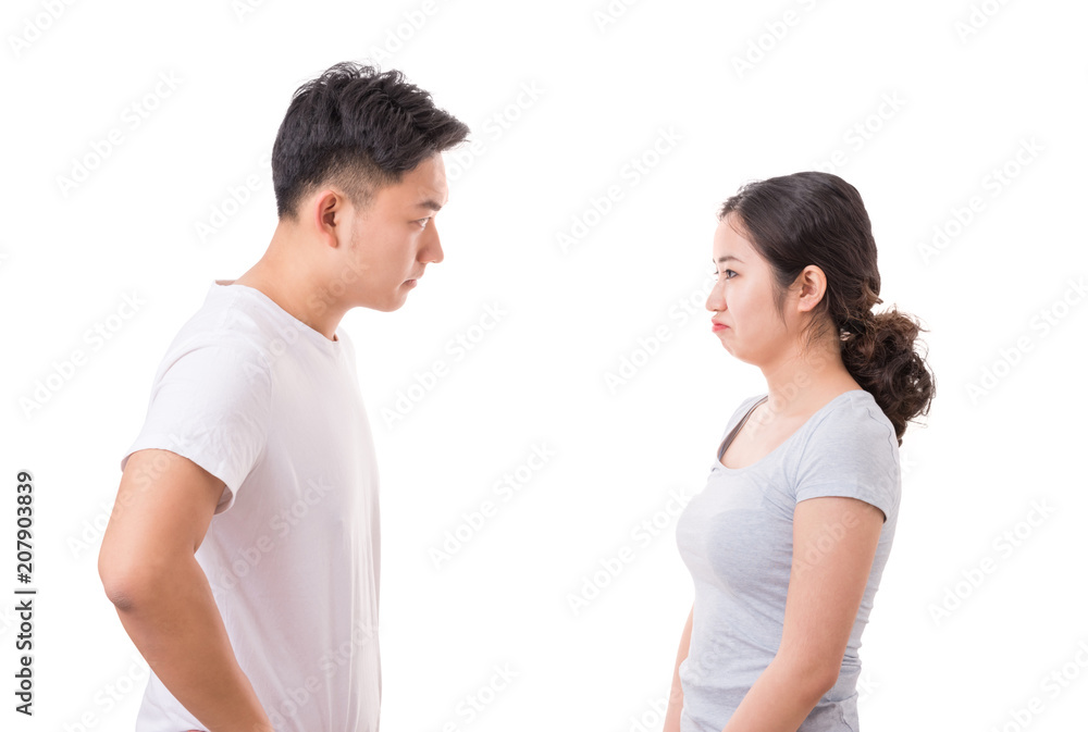 Portrait of angry couple looking at each other during conflict Portrait of angry couple looking at each other during conflict