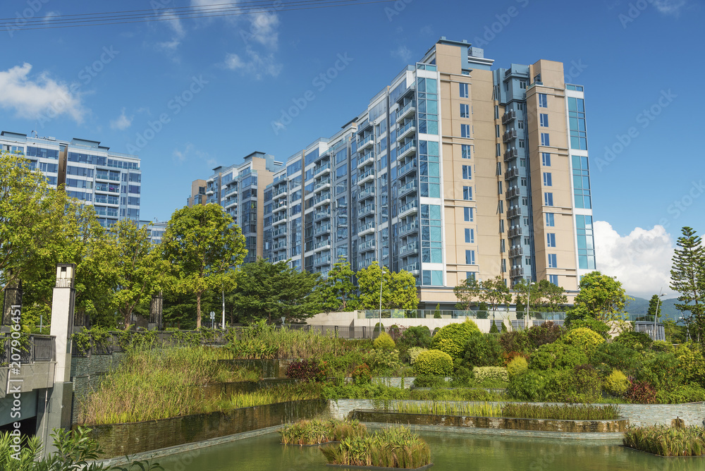 Residential building in the public green park in Hong Kong city Residential building in the public green park in Hong Kong city