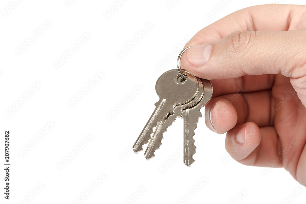 Keys from the lock in hand on white background. Keys from the lock in hand on white background.