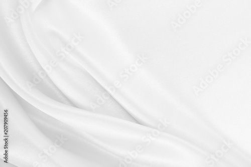 Smooth elegant white silk or satin luxury cloth texture as wedding background. Luxurious Christmas background or New Year background design photo