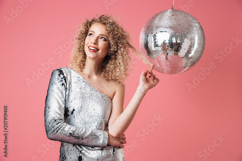 Portrait of a smiling beautiful woman in shiny dress photo