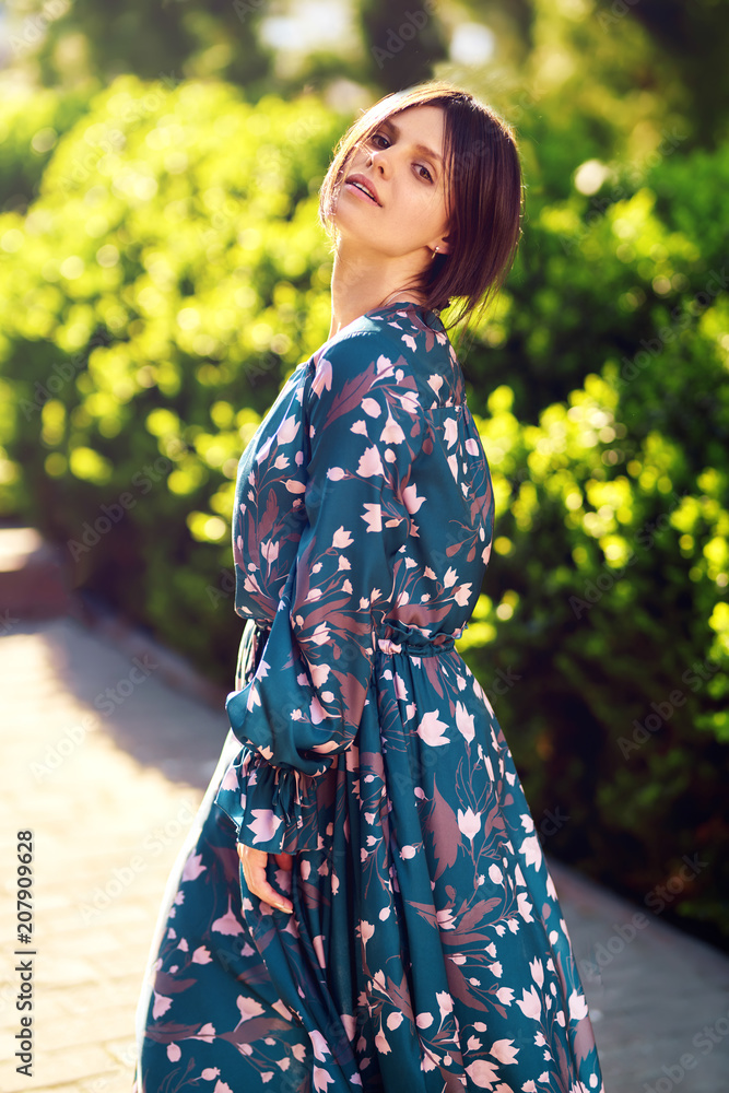 Beautiful young lady with cute and long blue dress enjoy sunset .Nice summer evening. Sunlights . Fashion and style concept. Beautiful young lady with cute and long blue dress enjoy sunset .Nice summer evening. Sunlights . Fashion and style concept.