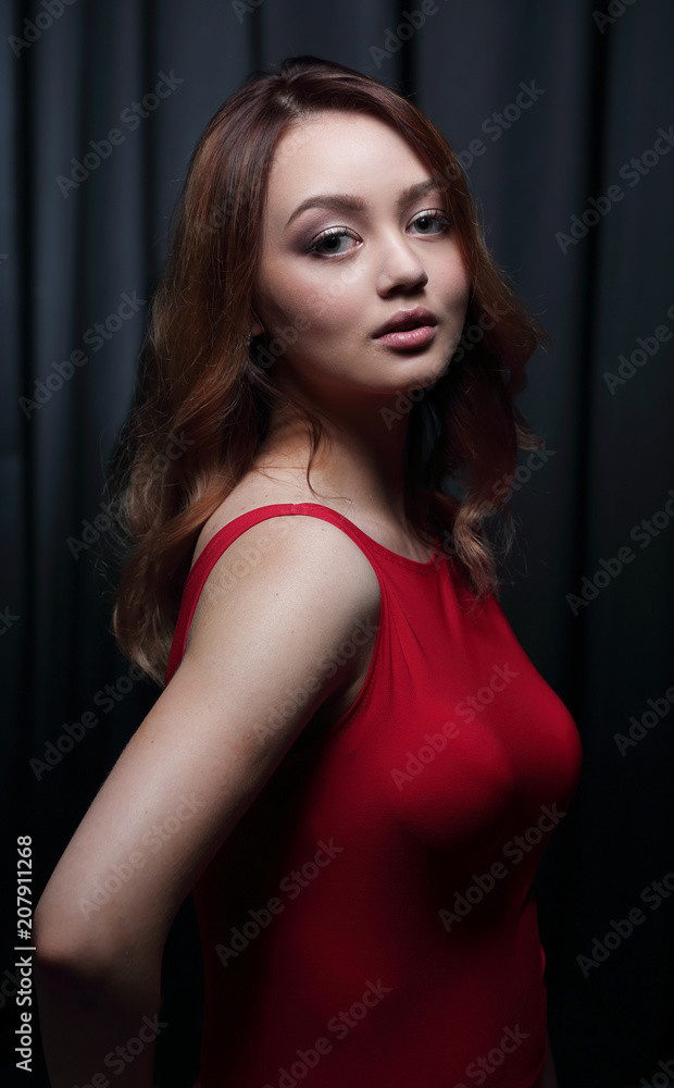 Fashionable young beautiful woman in a red dress Fashionable young beautiful woman in a red dress