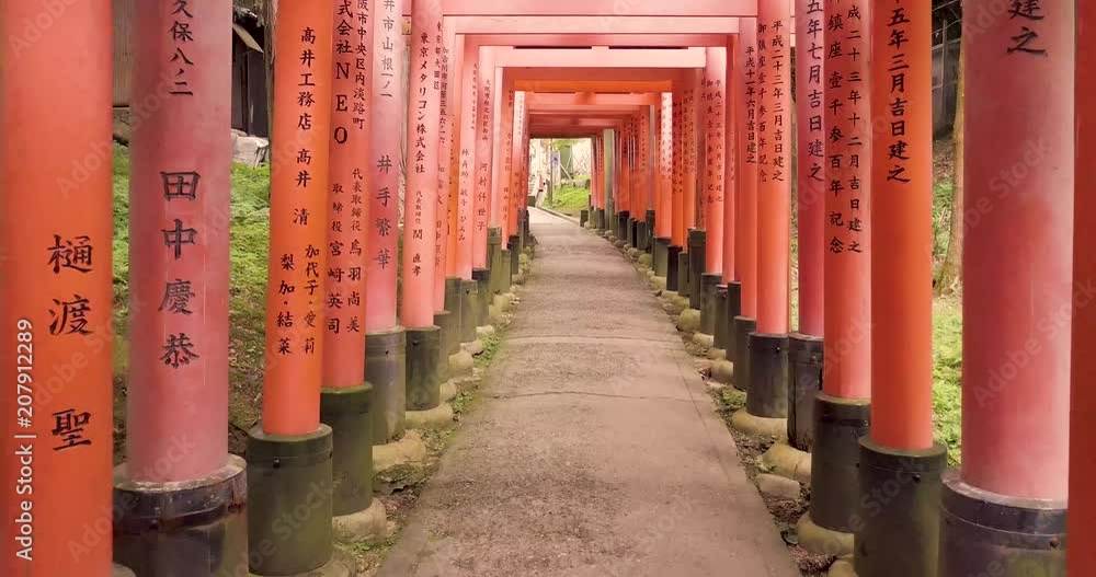 Walking through Fushimi Inari Taisha, 1000 red gates (torii) in Kyoto Japan. Walking through Fushimi Inari Taisha, 1000 red gates (torii) in Kyoto Japan.