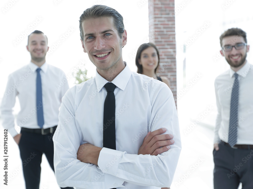 portrait of a successful business person on the background of colleagues.