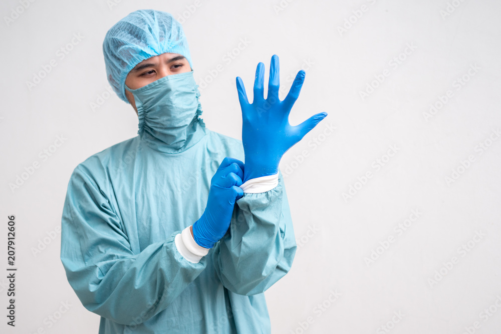 Portrait of a young surgeon over white background. Portrait of a young surgeon over white background.