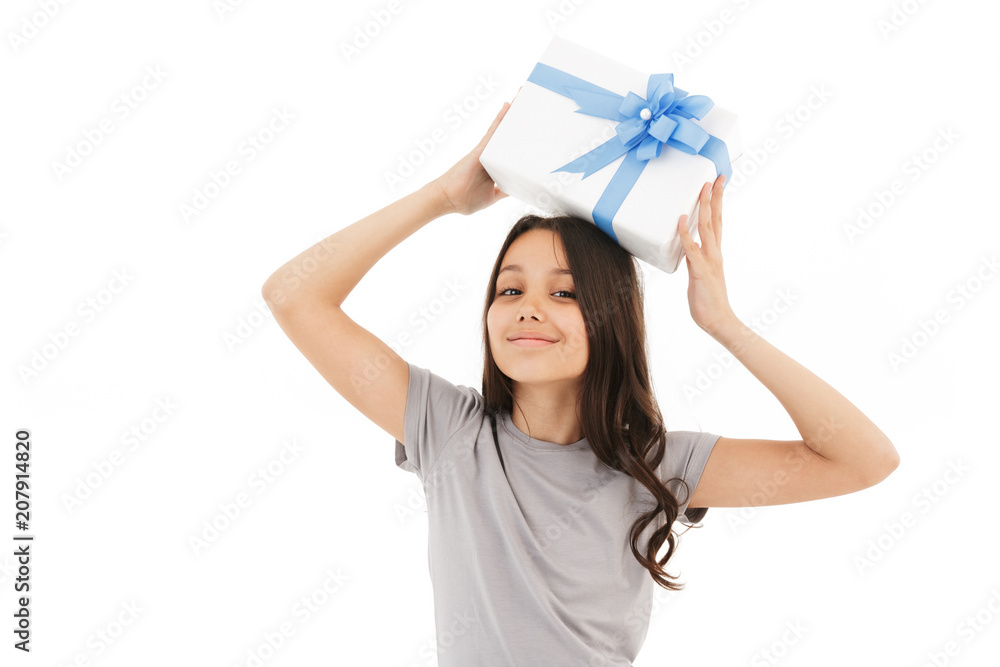 Happy girl standing isolated holding surprise gift box. Happy girl standing isolated holding surprise gift box.