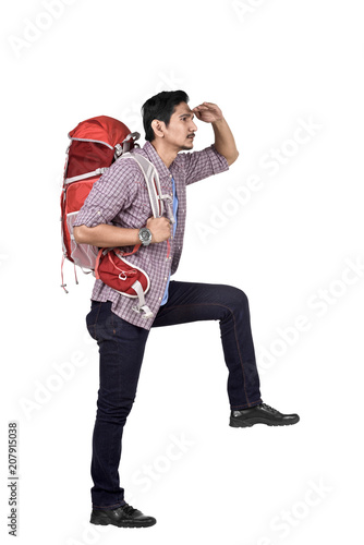 Side view of asian backpacker looking at view
