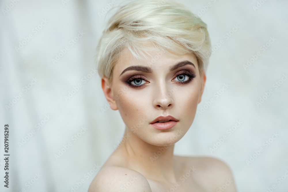 Fashion photo of beautiful woman with fashionable haircut Fashion photo of beautiful woman with fashionable haircut