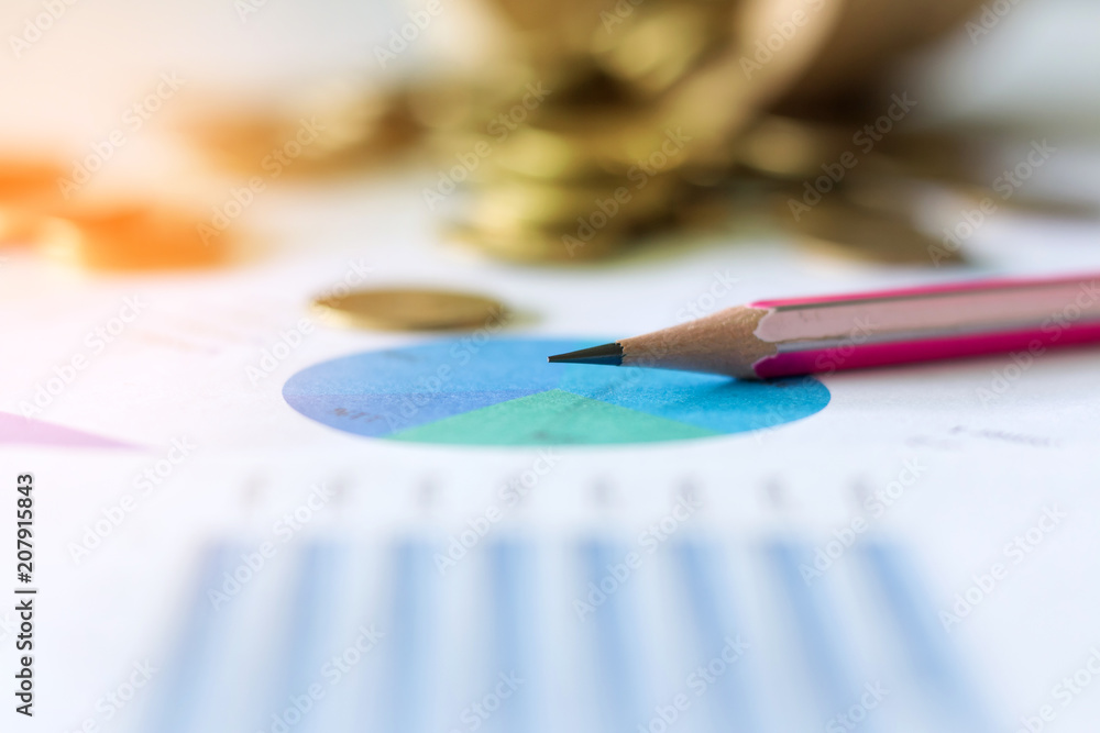 business graph chart and pencil and coin on desk business graph chart and pencil and coin on desk