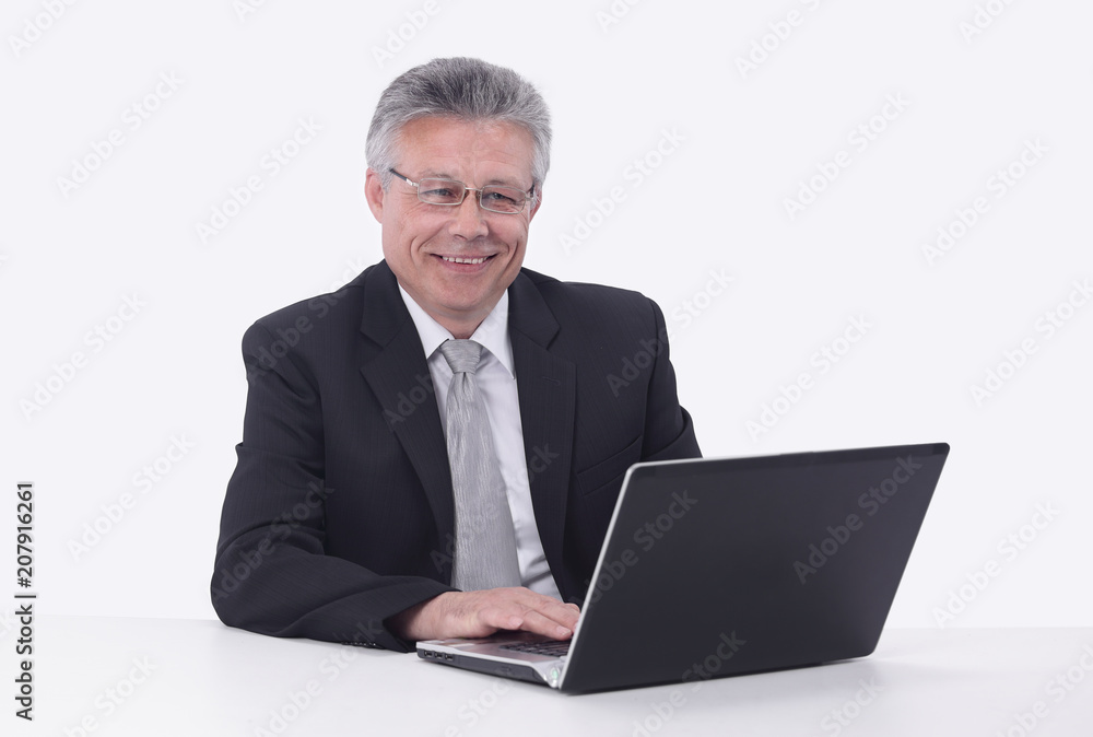 elderly businessman working on a laptop. elderly businessman working on a laptop.