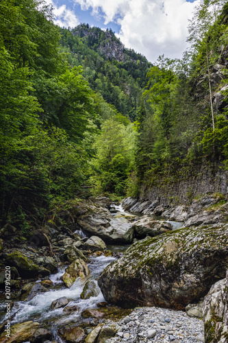 a beautiful mountain river among the rocks with crystal water © czamfir
