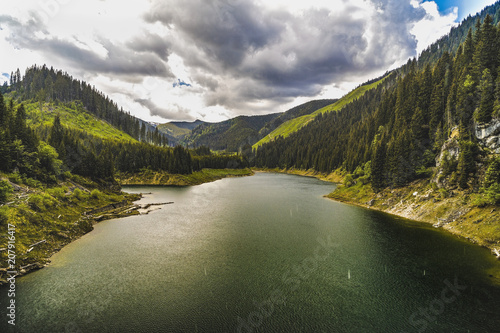 Landscape with lake Galbenu in a rainy day photo