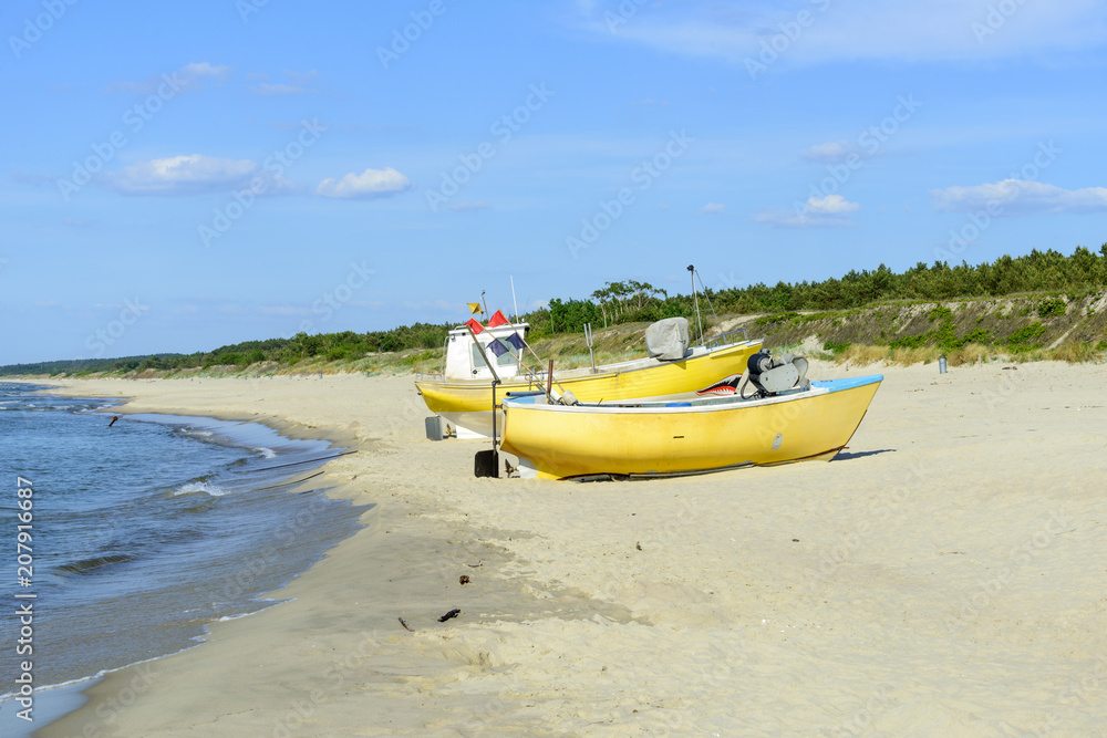 Fishing boat on Baltic Beach in Piaski near Krynica Morska, Poland Fishing boat on Baltic Beach in Piaski near Krynica Morska, Poland
