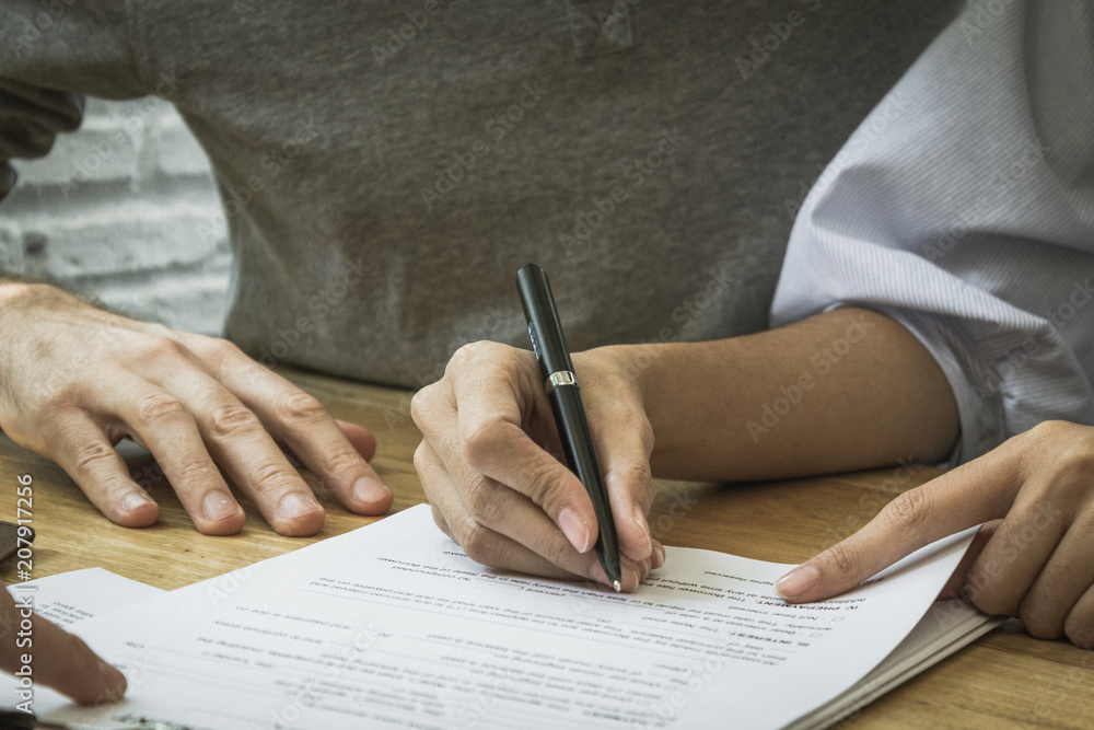 Contract signature for business and financial contract. Sign on the dotted line. Male caucasian pen signs a paper. Contract signature for business and financial contract. Sign on the dotted line. Male caucasian pen signs a paper.