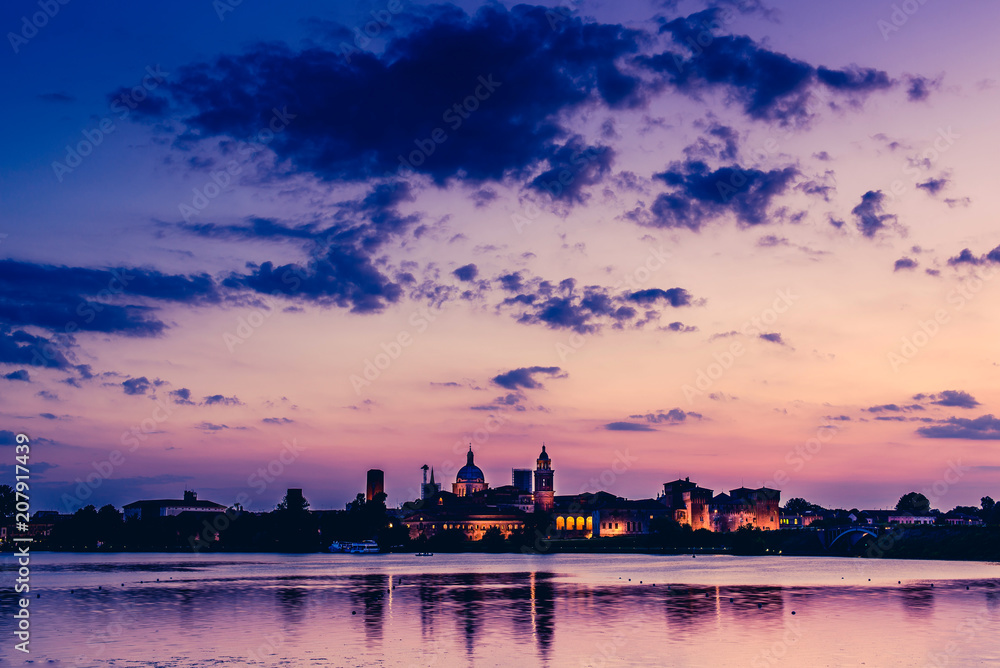 skyline at sunset and pier on the lake - italian landcsape and travel destinations - Mantua italy
