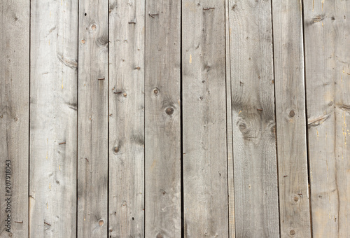 wooden background, wooden wall of thin boards with nails and slits