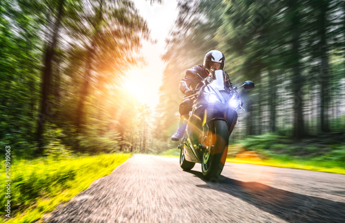 motorbike on the road riding. having fun riding the empty road on a motorcycle tour / journey