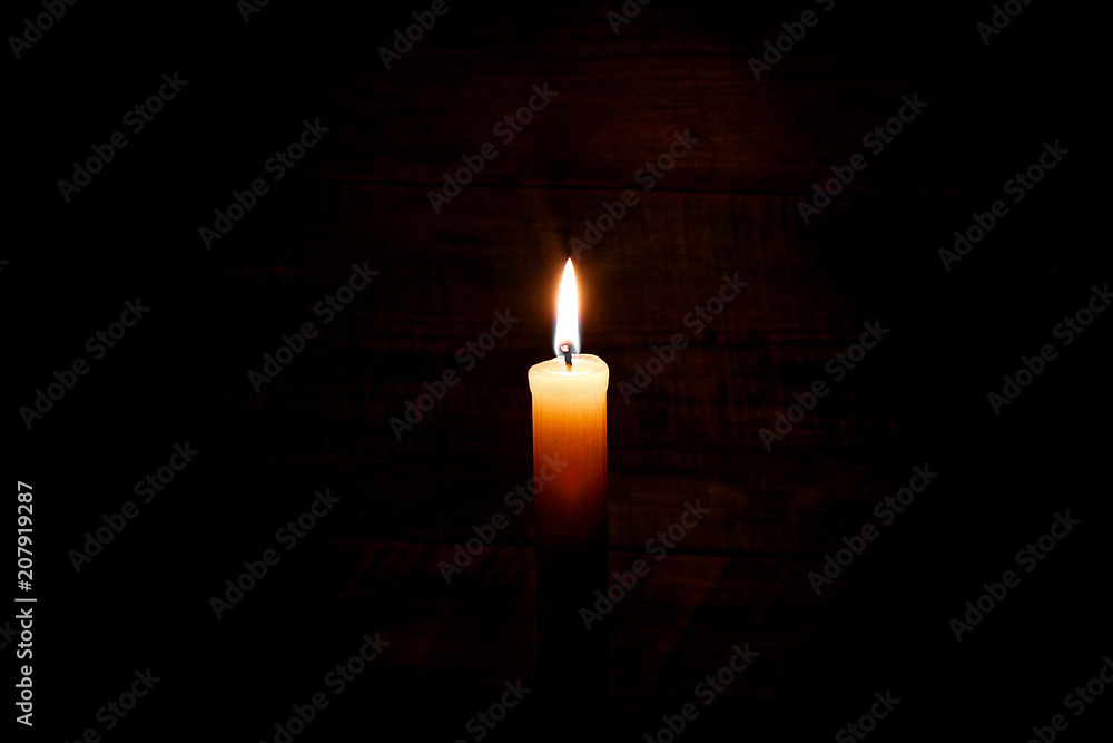 candle on old wooden background candle on old wooden background