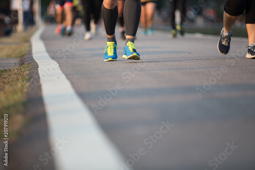 Group of people running race marathon