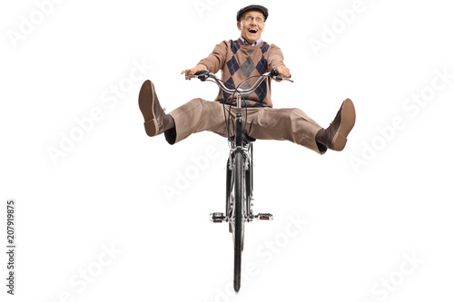 Overjoyed senior riding a bicycle © Ljupco Smokovski