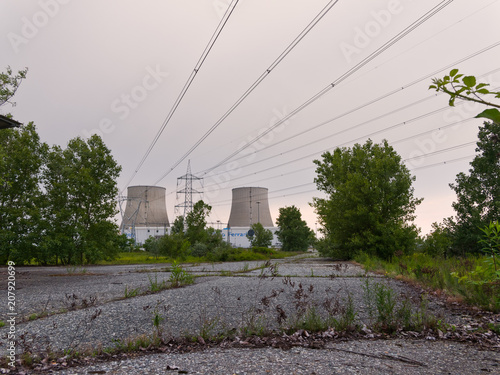 Trino, Italy, May 19, 2018 - High Voltage electrical cables and road coming out of the thermoelectric power plant, central Enel Galileo Ferraris, Trino-Leri-Cavour photo